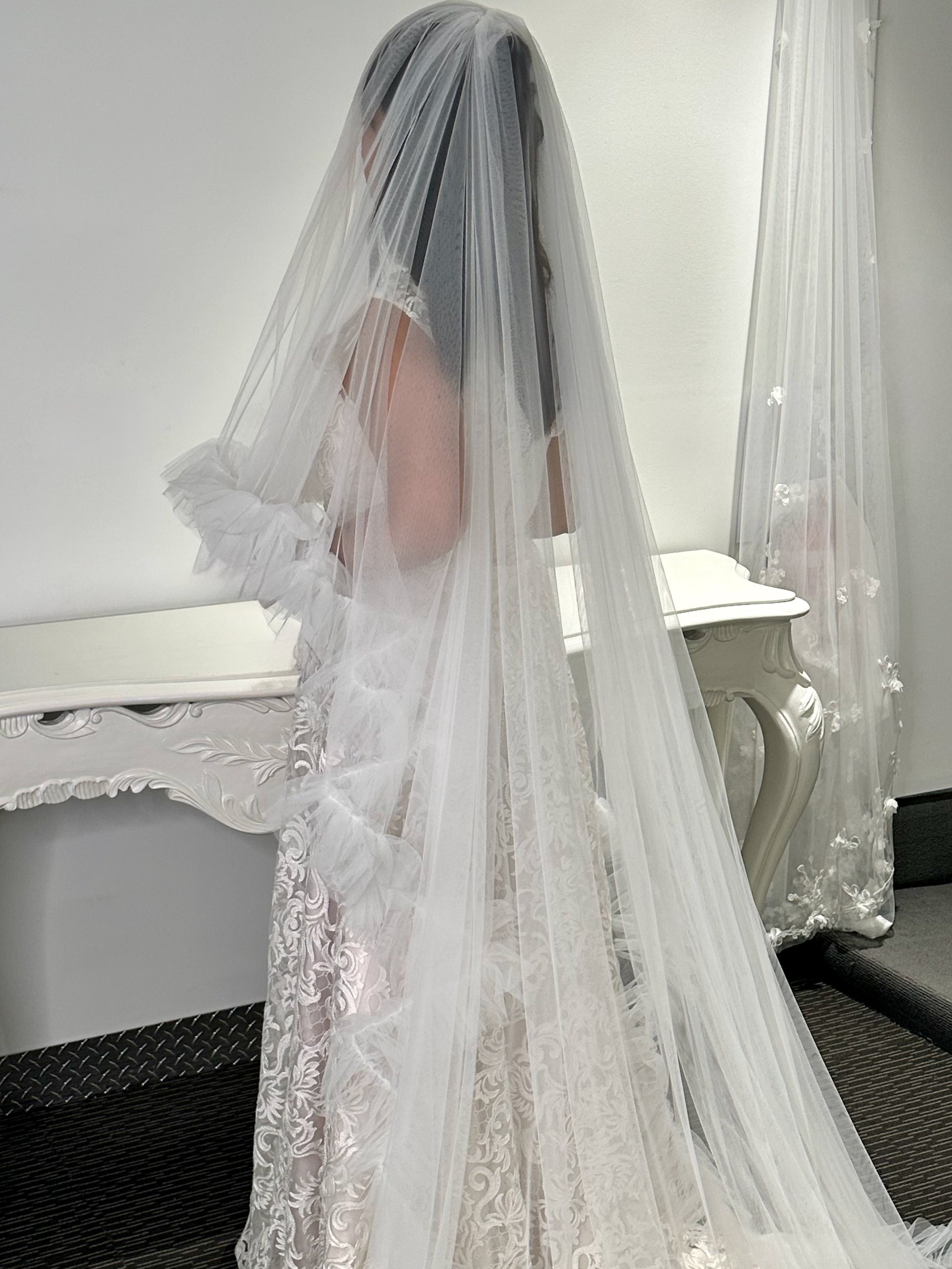 White lace wedding veil with a blurred background
