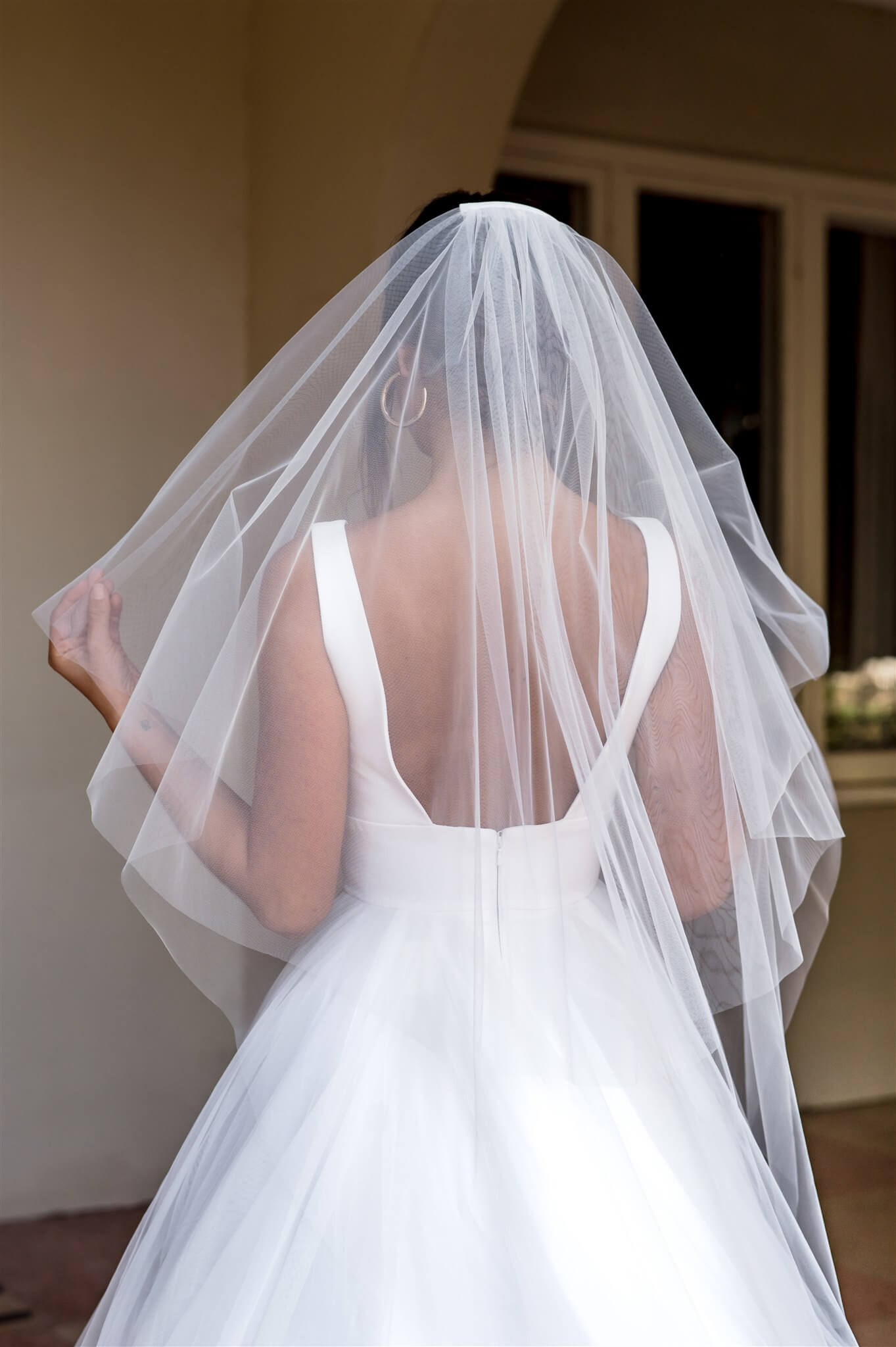 Bride wearing a white wedding dress with a long veil